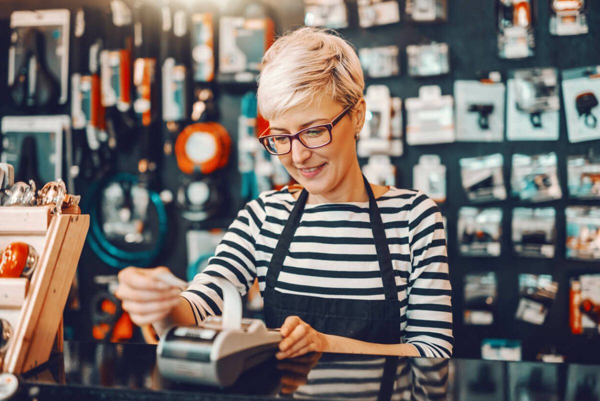 cashier handling a till in a store