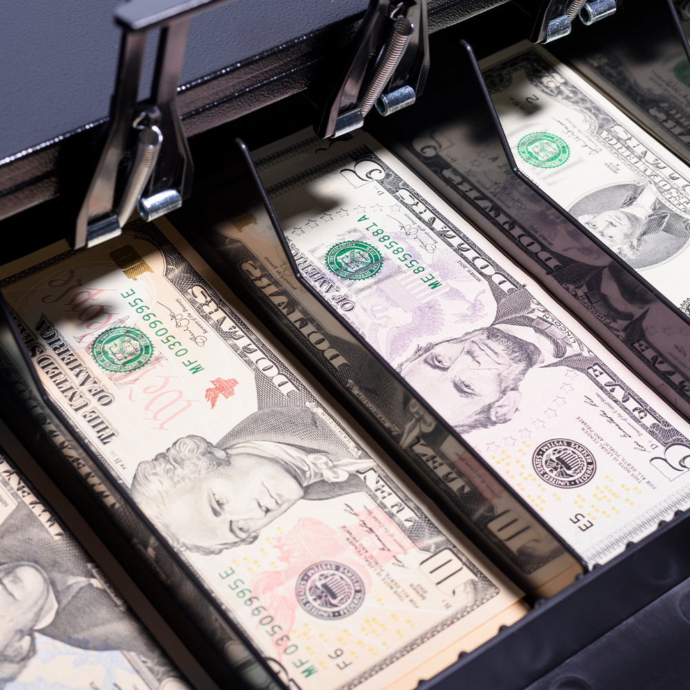 an open cash drawer on a retail cash register