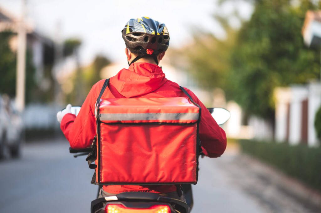 a delivery driver delivering food from a convenience store