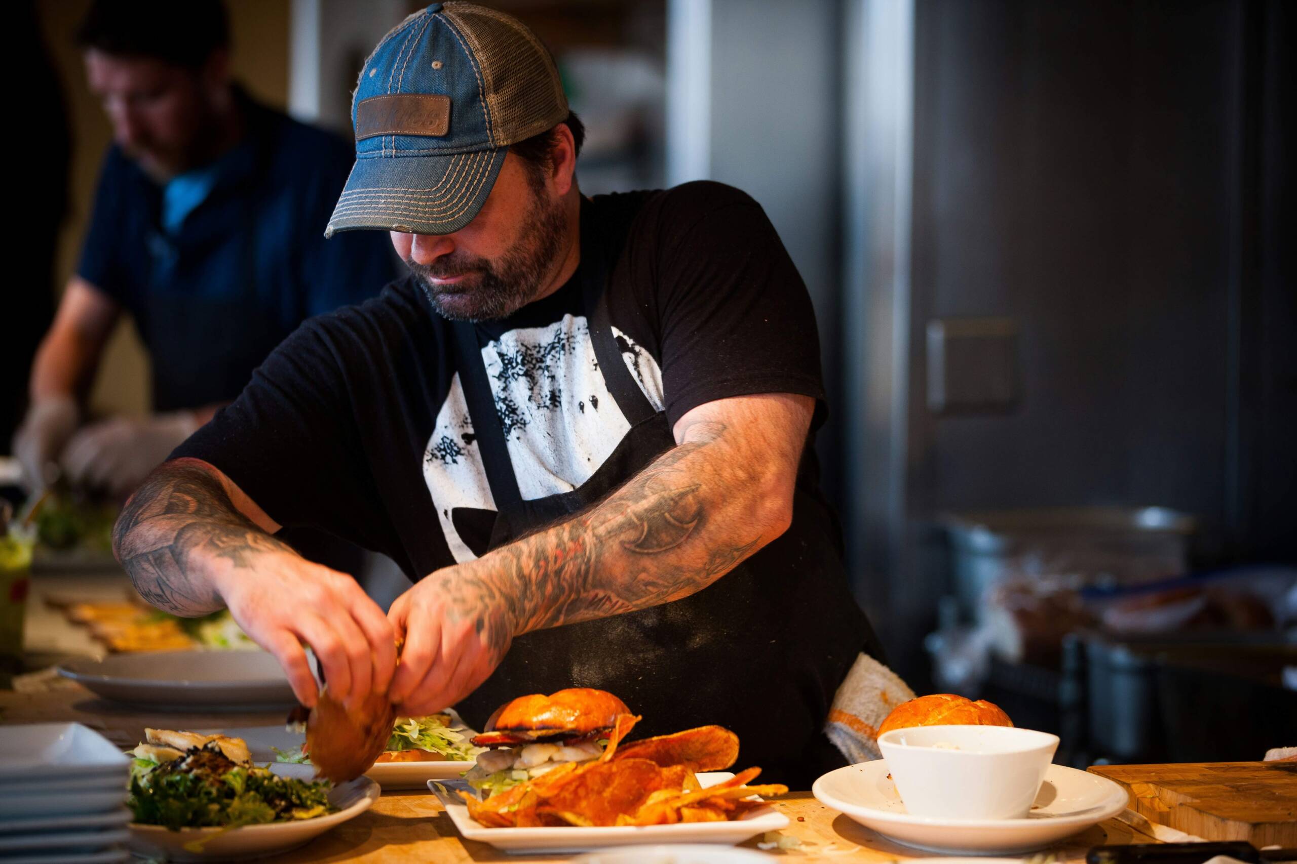 a franchise restaurant owner plating food